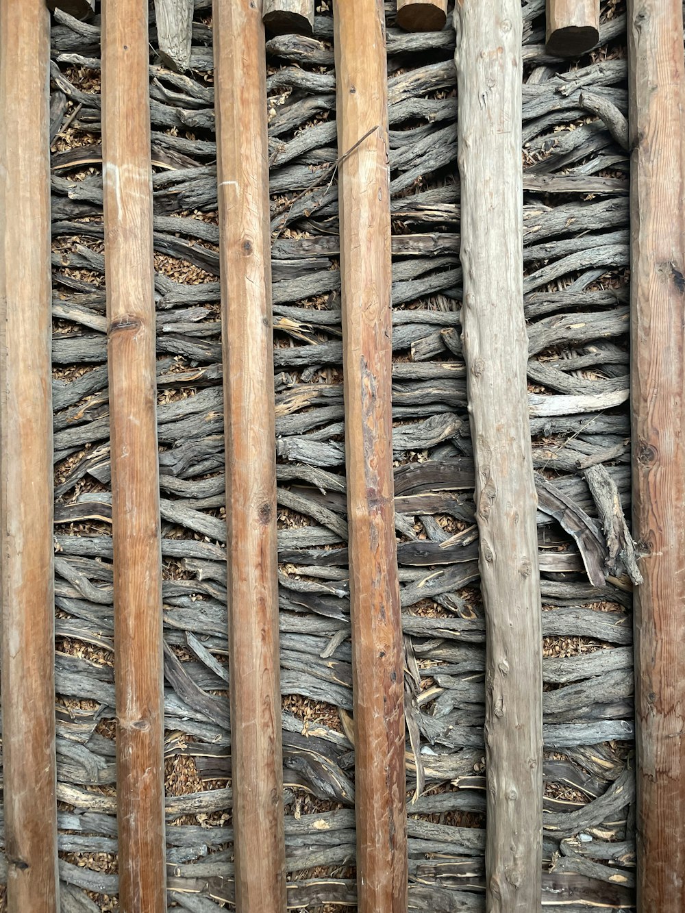 a close up of a wall made of wood sticks
