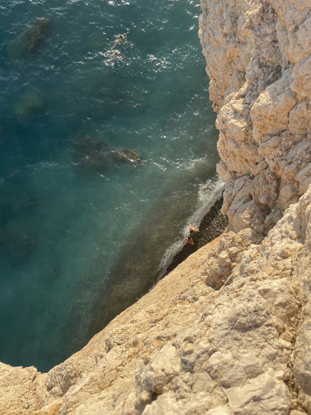 a view of a body of water from a cliff