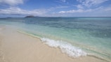 A tranquil beach on the island of Capri with crystal-clear waters.