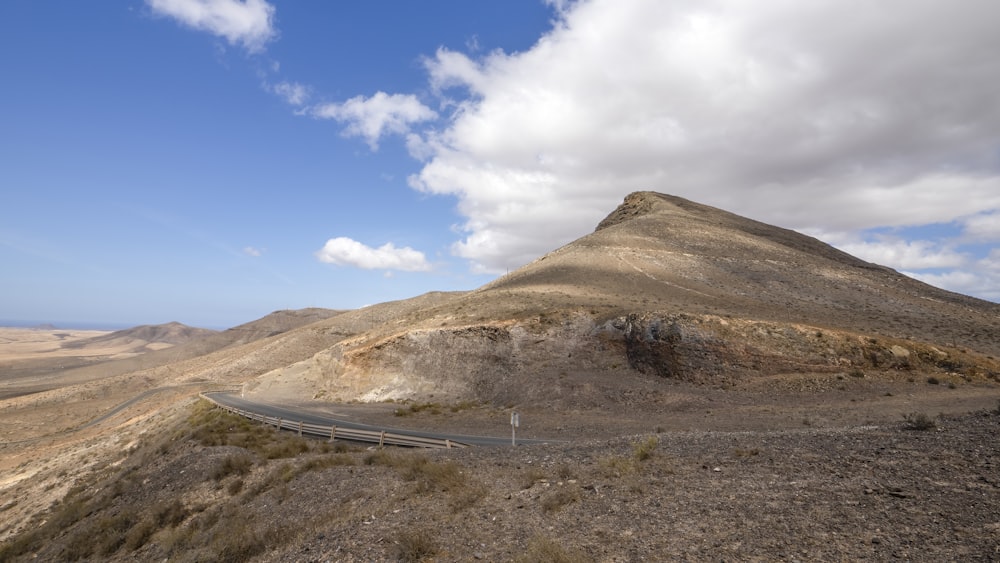 a road on the side of a mountain in the desert