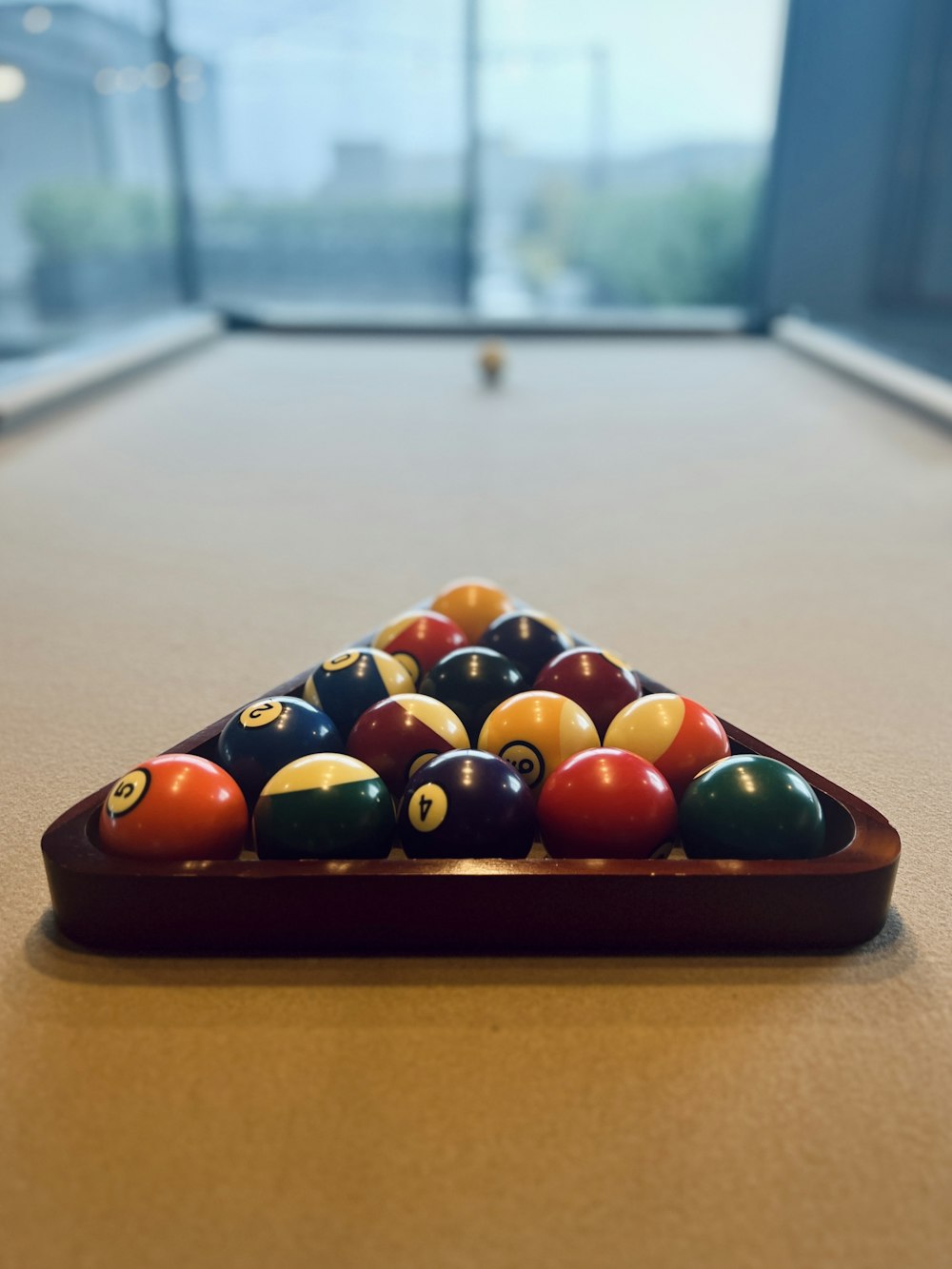 a pool table with a rack of pool balls