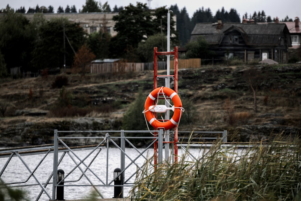 a life preserver on a dock near a body of water