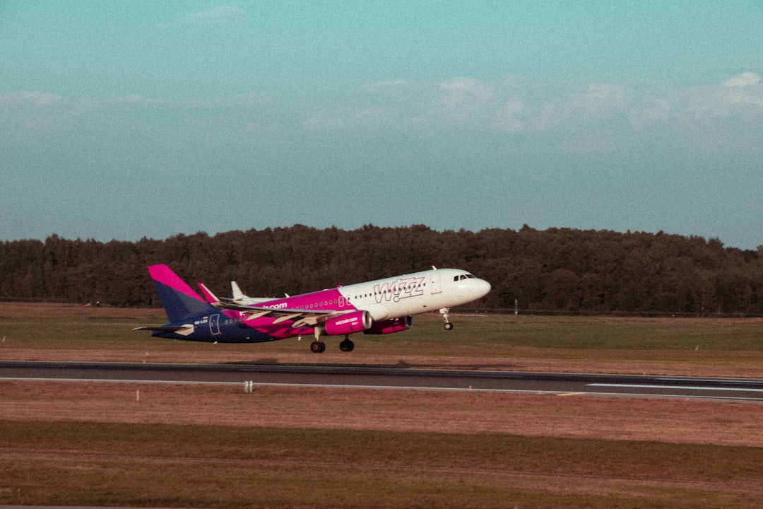 a large passenger jet taking off from an airport runway,