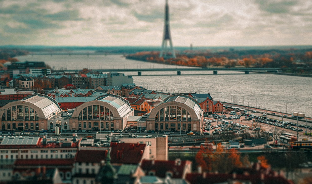 an aerial view of a city with a river in the background