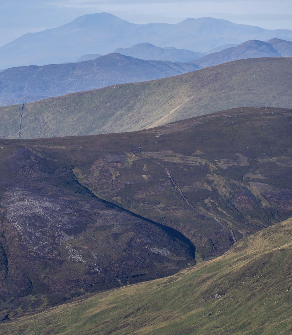 a mountain range with mountains in the distance