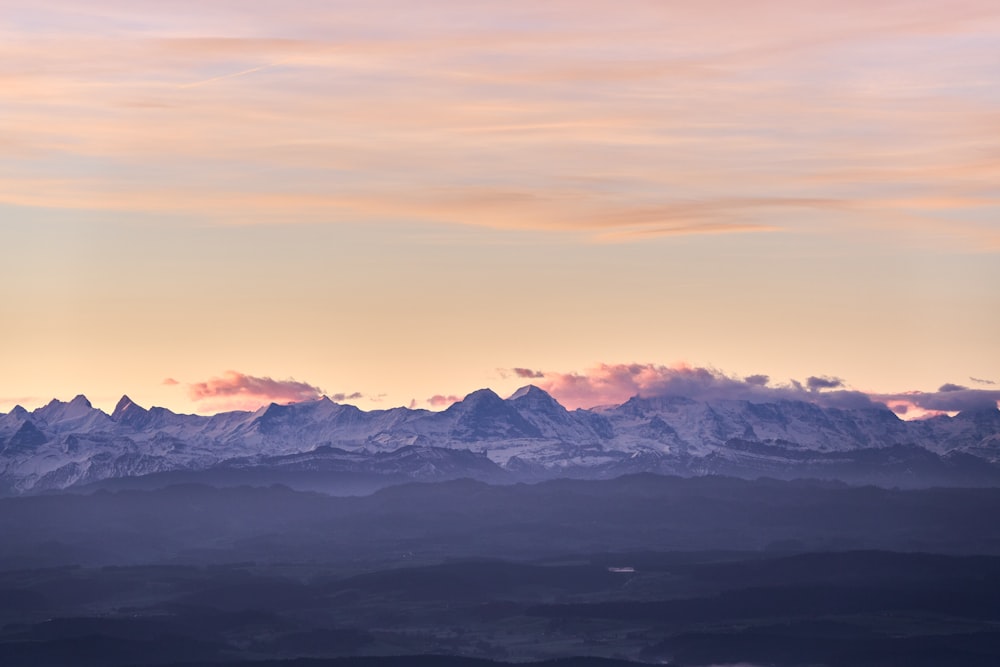 a view of a mountain range at sunset