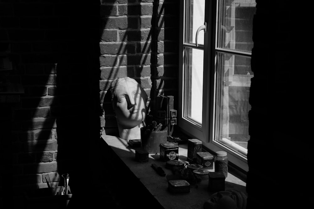 a black and white photo of a window sill