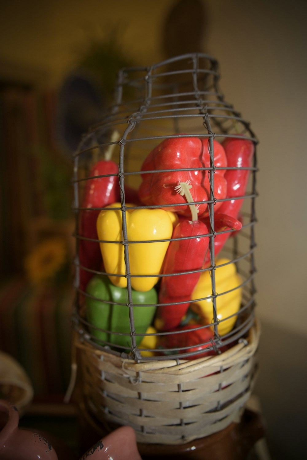 a basket filled with peppers and peppers on top of a table