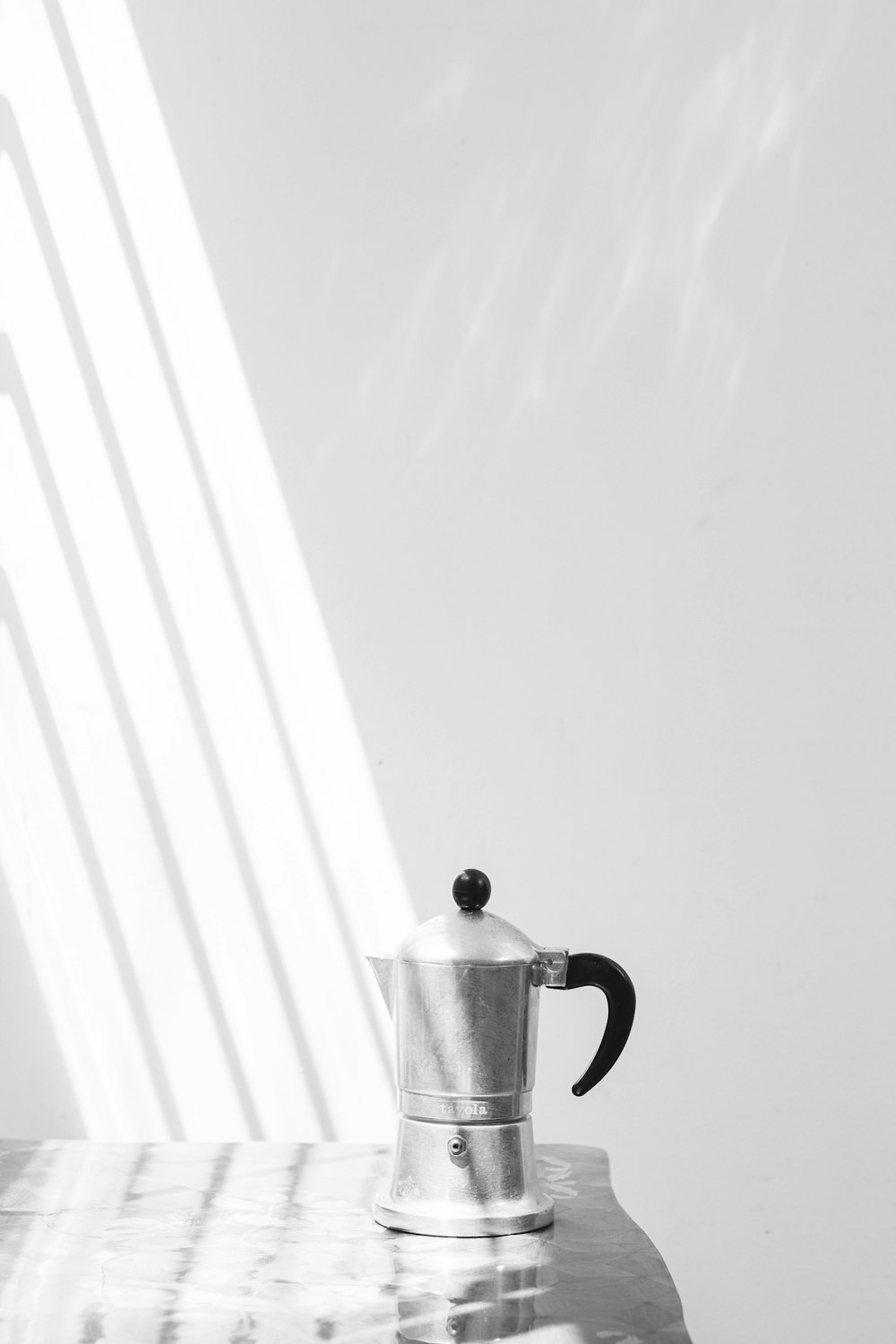 a coffee pot sitting on top of a table