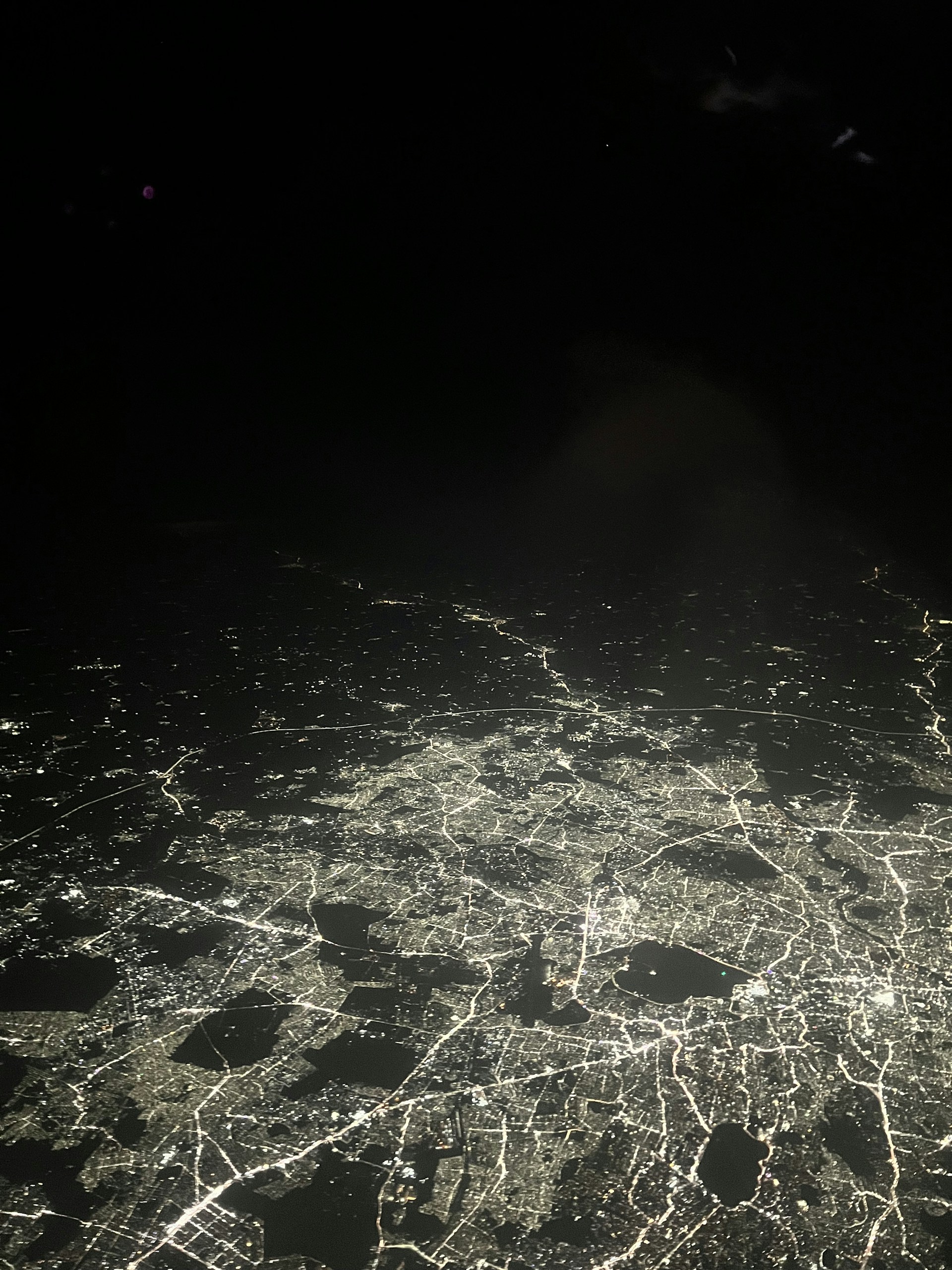 an aerial view of a city at night