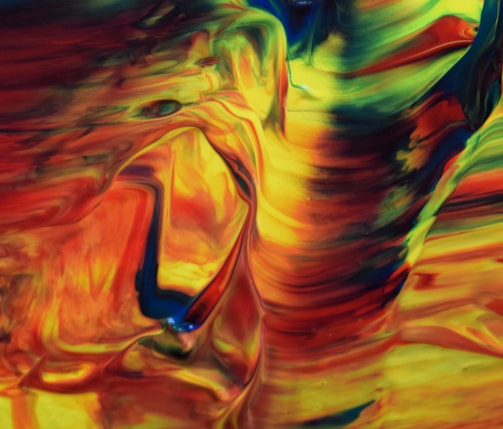 A vibrant swirl of reds, blues, and yellows blending in an abstract pattern.