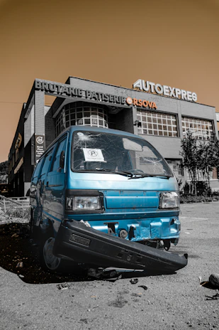 Before and after shots of a van’s damaged side panel transformed by expert bodywork and painting.