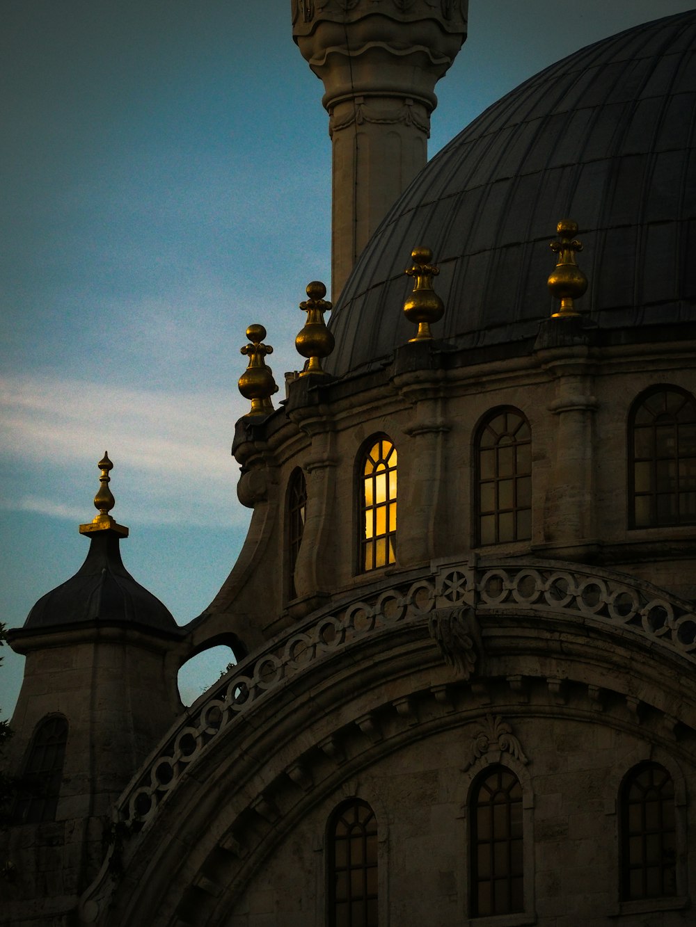 a building with a dome and a clock on it