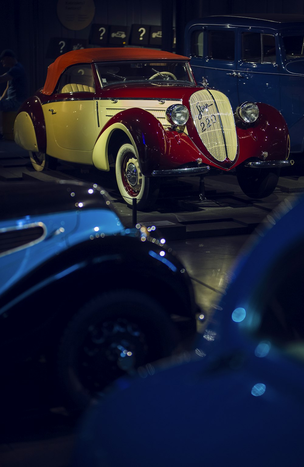 a group of cars parked next to each other in a garage