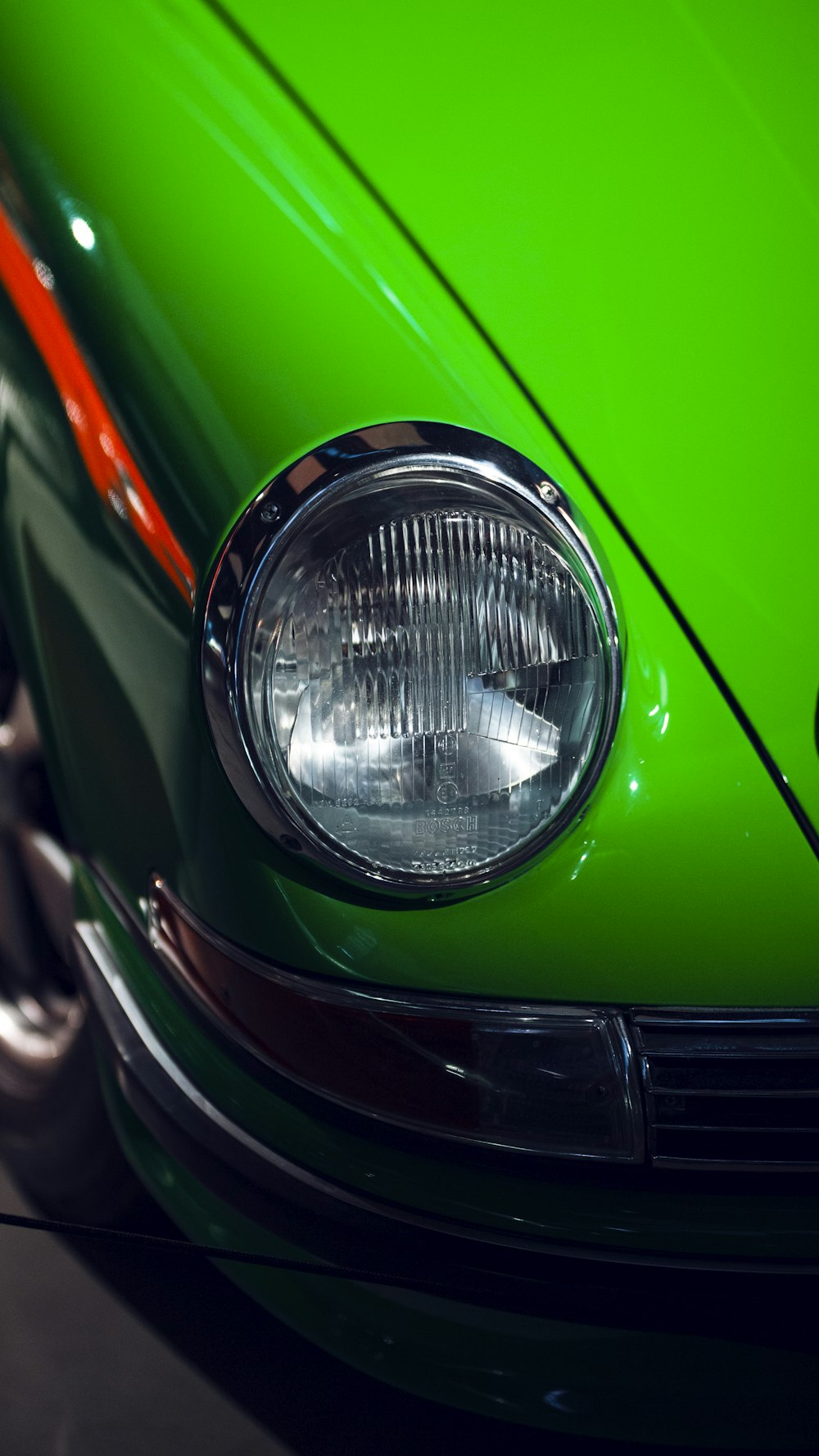 a close up of the front of a green car