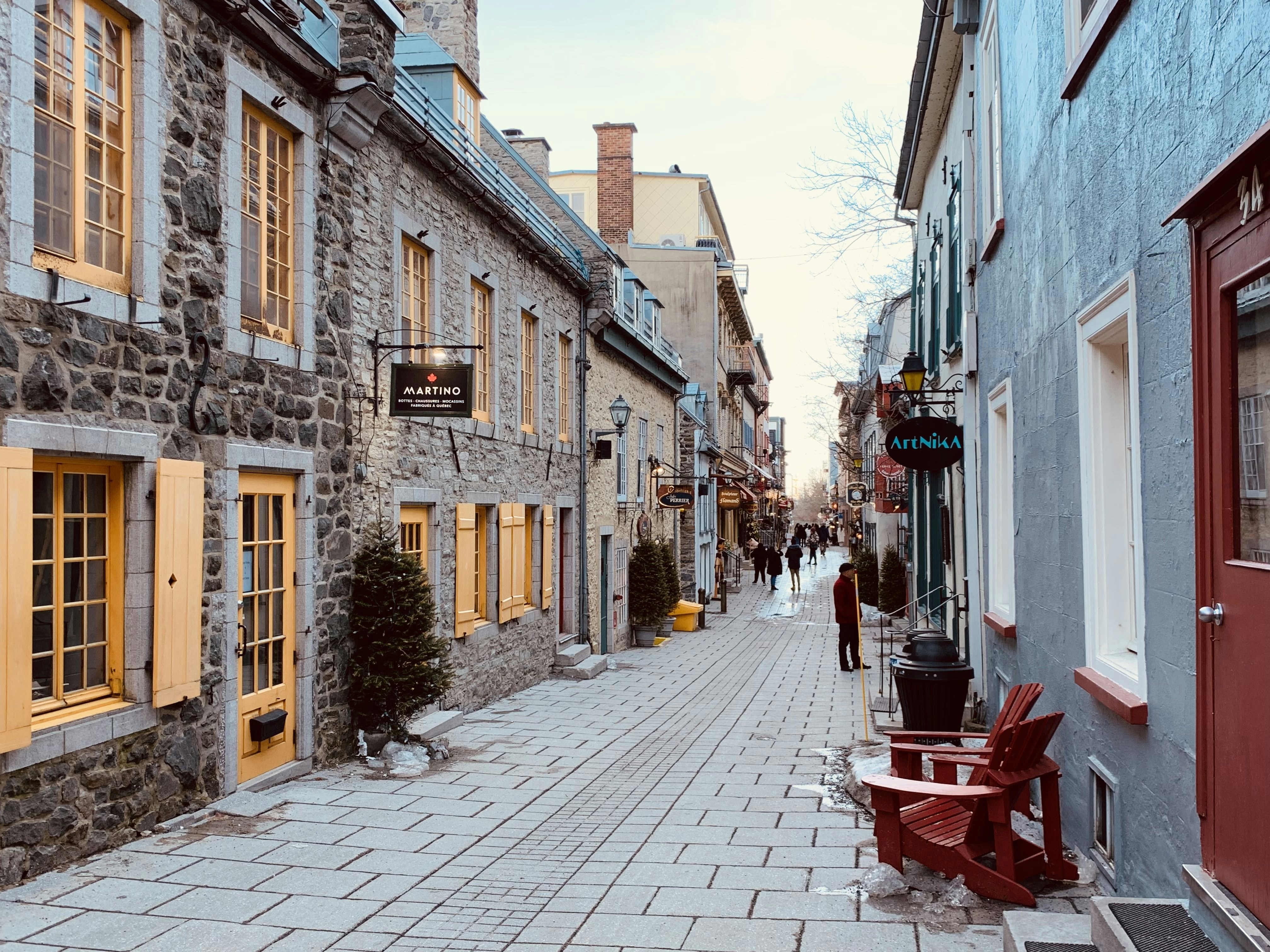 a cobblestone street lined with stone buildings