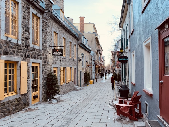 a cobblestone street lined with stone buildings