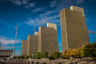 a couple of tall buildings sitting next to each other