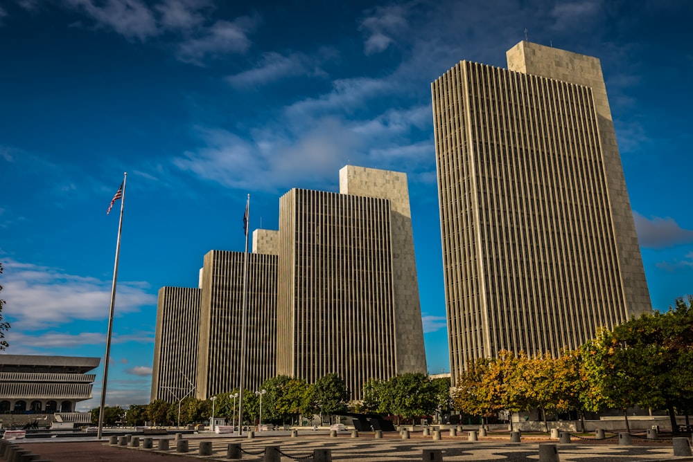 a couple of tall buildings sitting next to each other