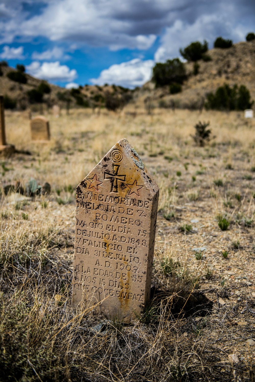 a grave in the middle of a field