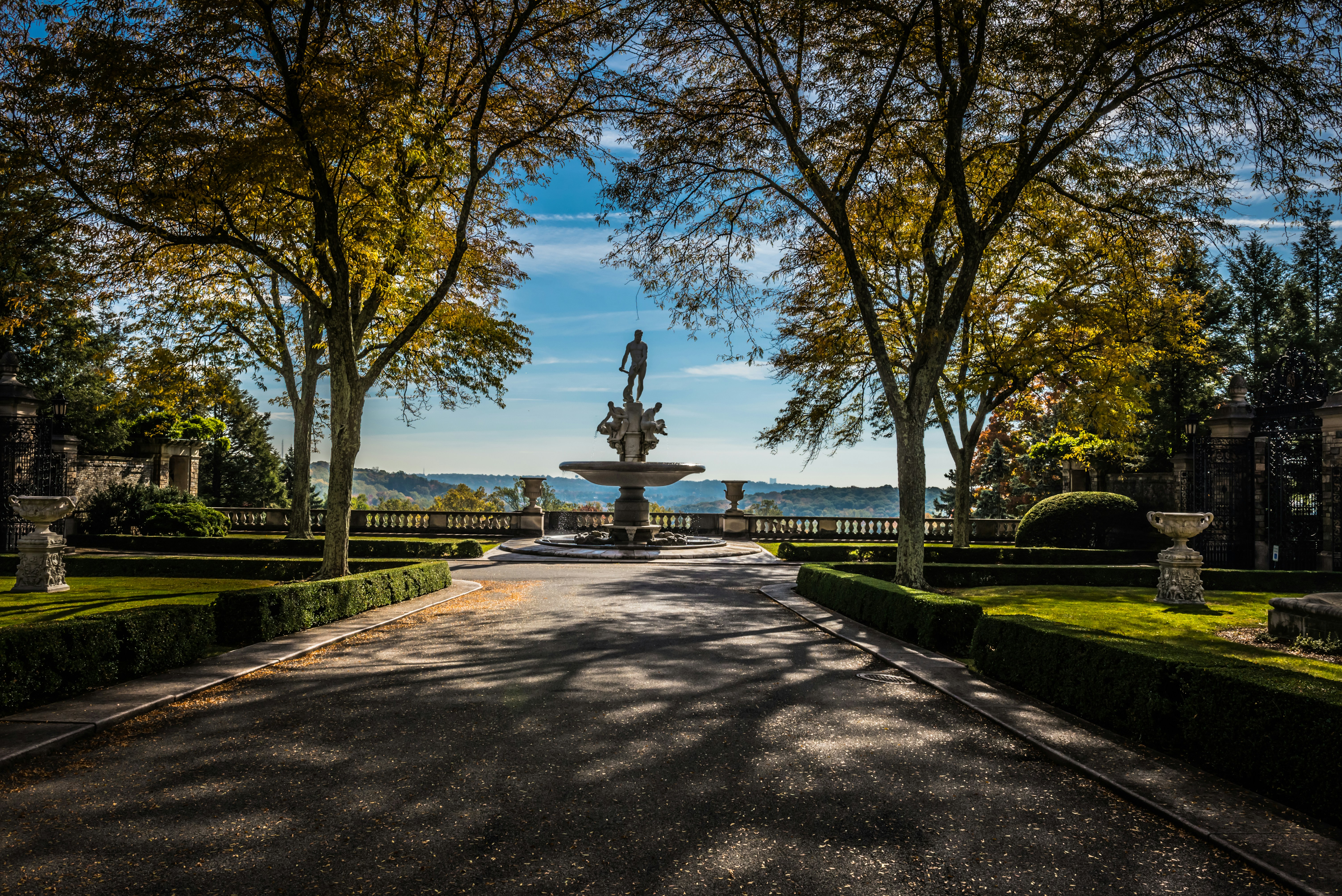 a road with a fountain in the middle of it
