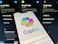 A smartphone displaying the 'Copilot' application screen, featuring a colorful logo and tagline 'Everyday AI companion'. The background consists of blurred images of digital applications such as Google Flights, Hotels, and Maps, suggesting various functionalities.