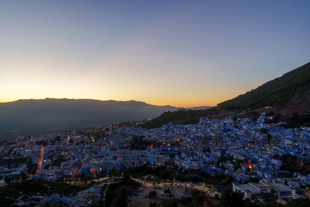 a view of a city with mountains in the background