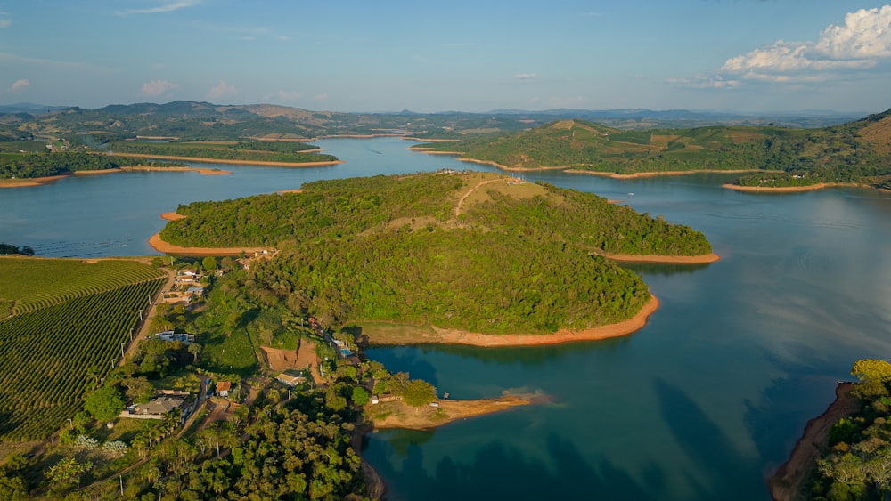 a large body of water surrounded by lush green hills