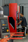 a man working on a machine in a factory