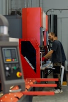 a man working on a machine in a factory