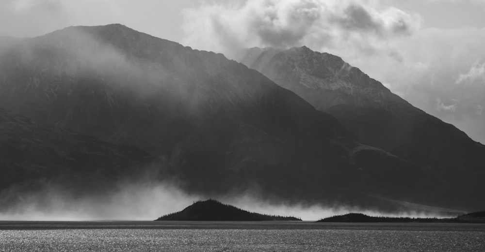 a black and white photo of a mountain range