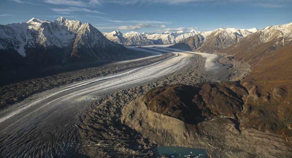 an aerial view of a glacier in the mountains