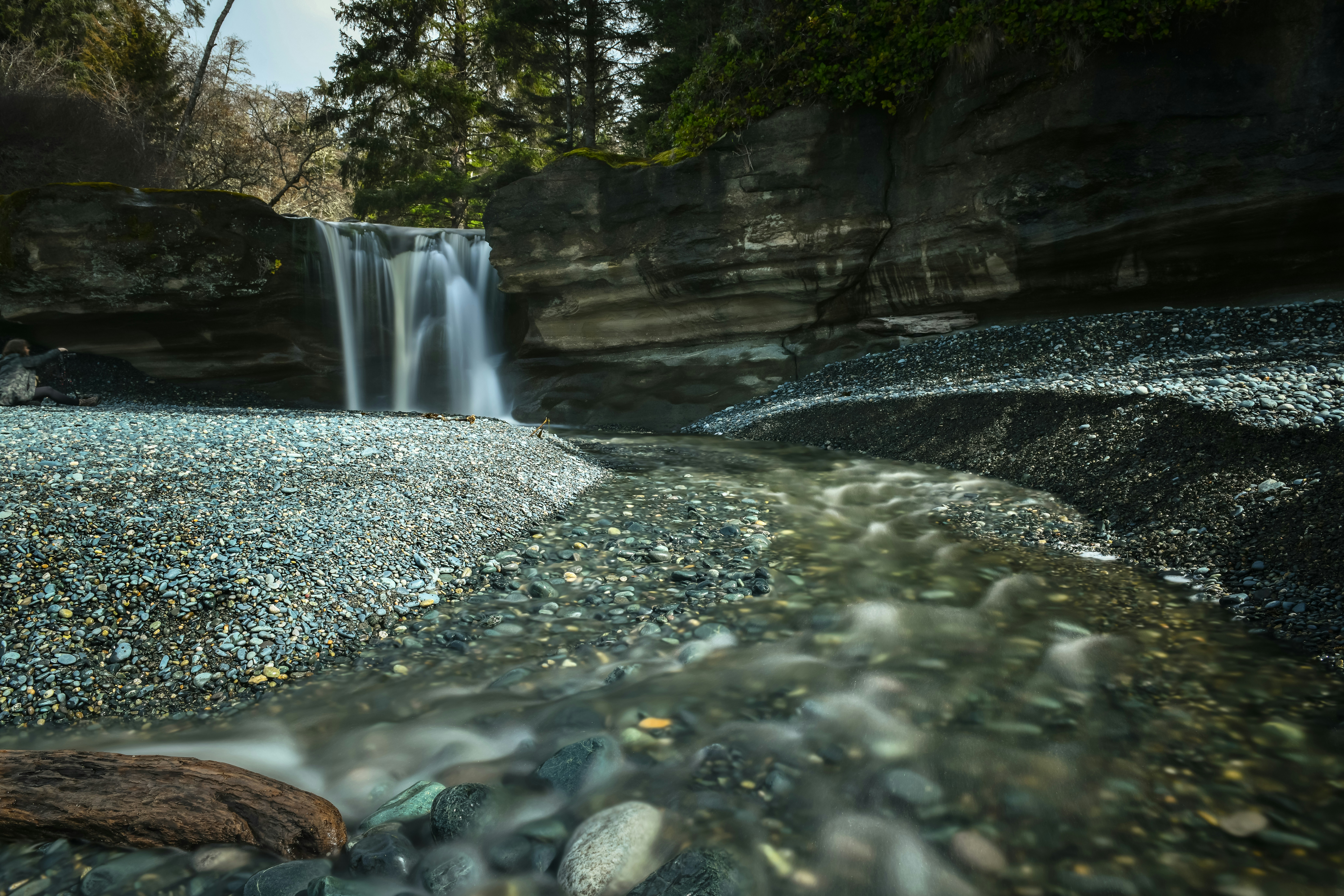 A small waterfall in the middle of a river photo – Free Beach Image on ...