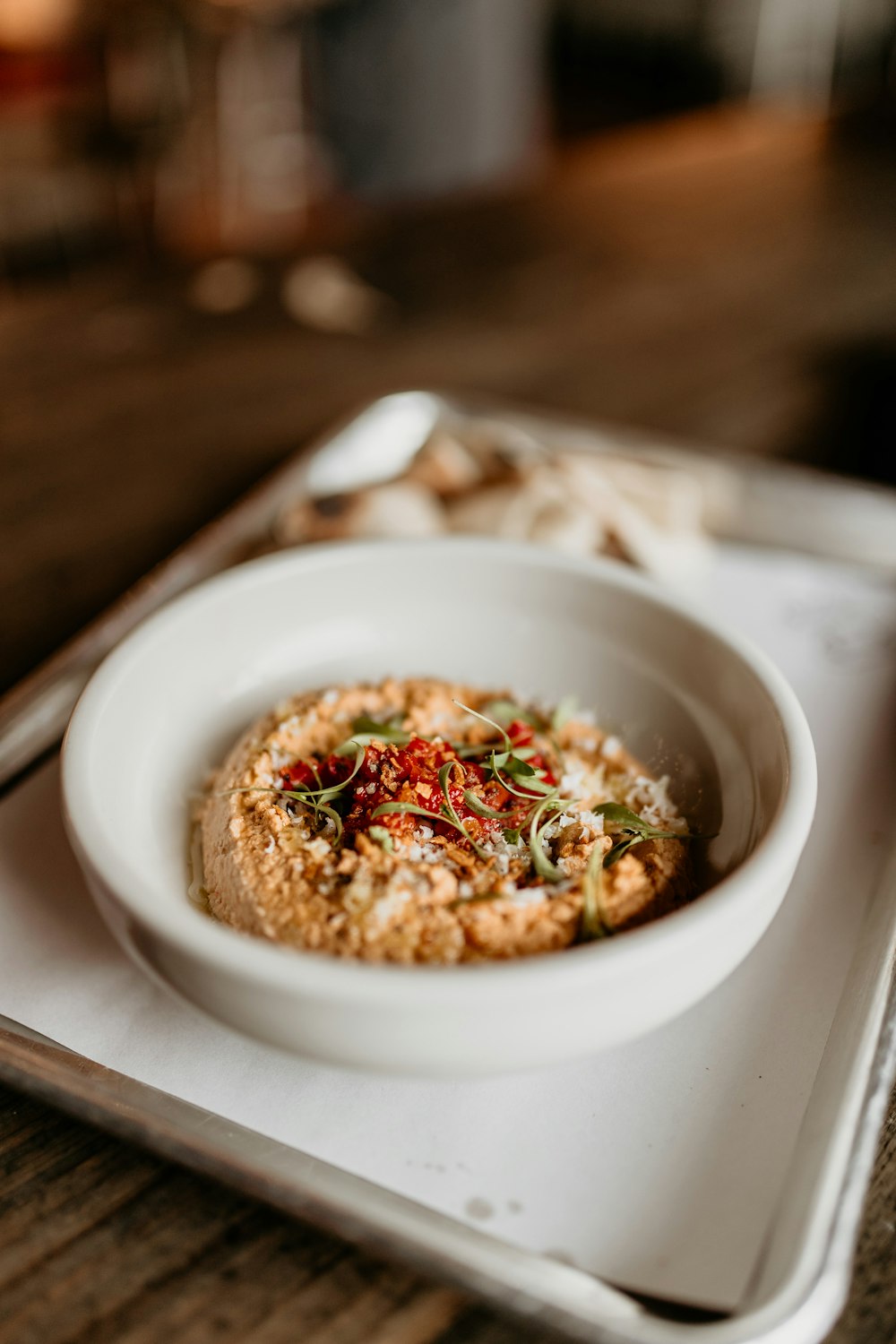 a bowl of food sitting on top of a white plate