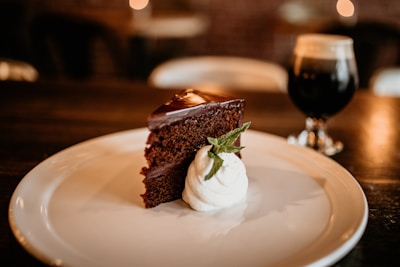 a piece of chocolate cake on a white plate