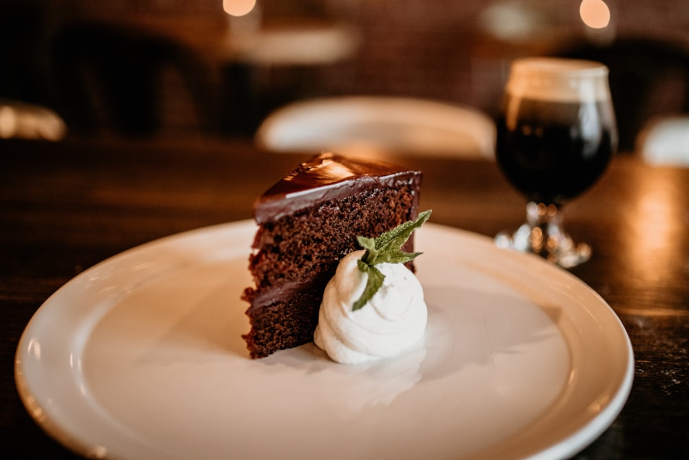 a piece of chocolate cake on a white plate