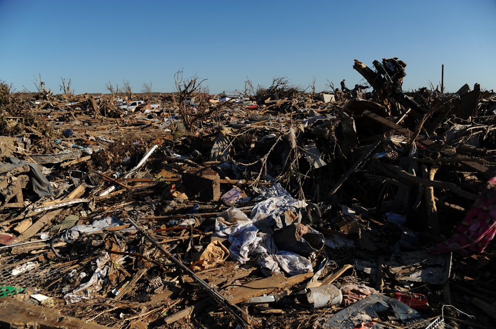 a pile of rubble with a blue sky in the background