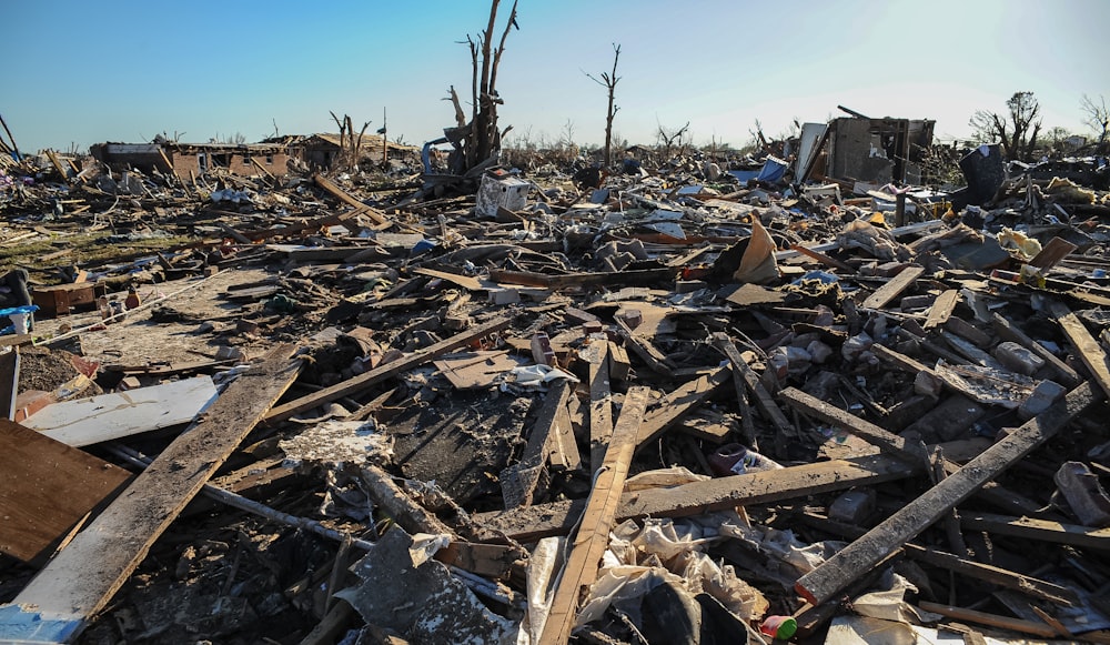 a pile of rubble with a blue sky in the background