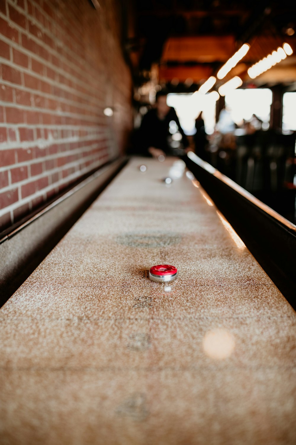 a close up of a red object on the ground