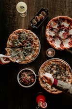 A group enjoying pizza together at a cozy private gathering