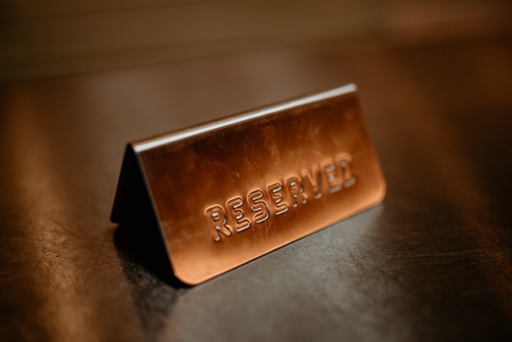 a gold bar sitting on top of a wooden table