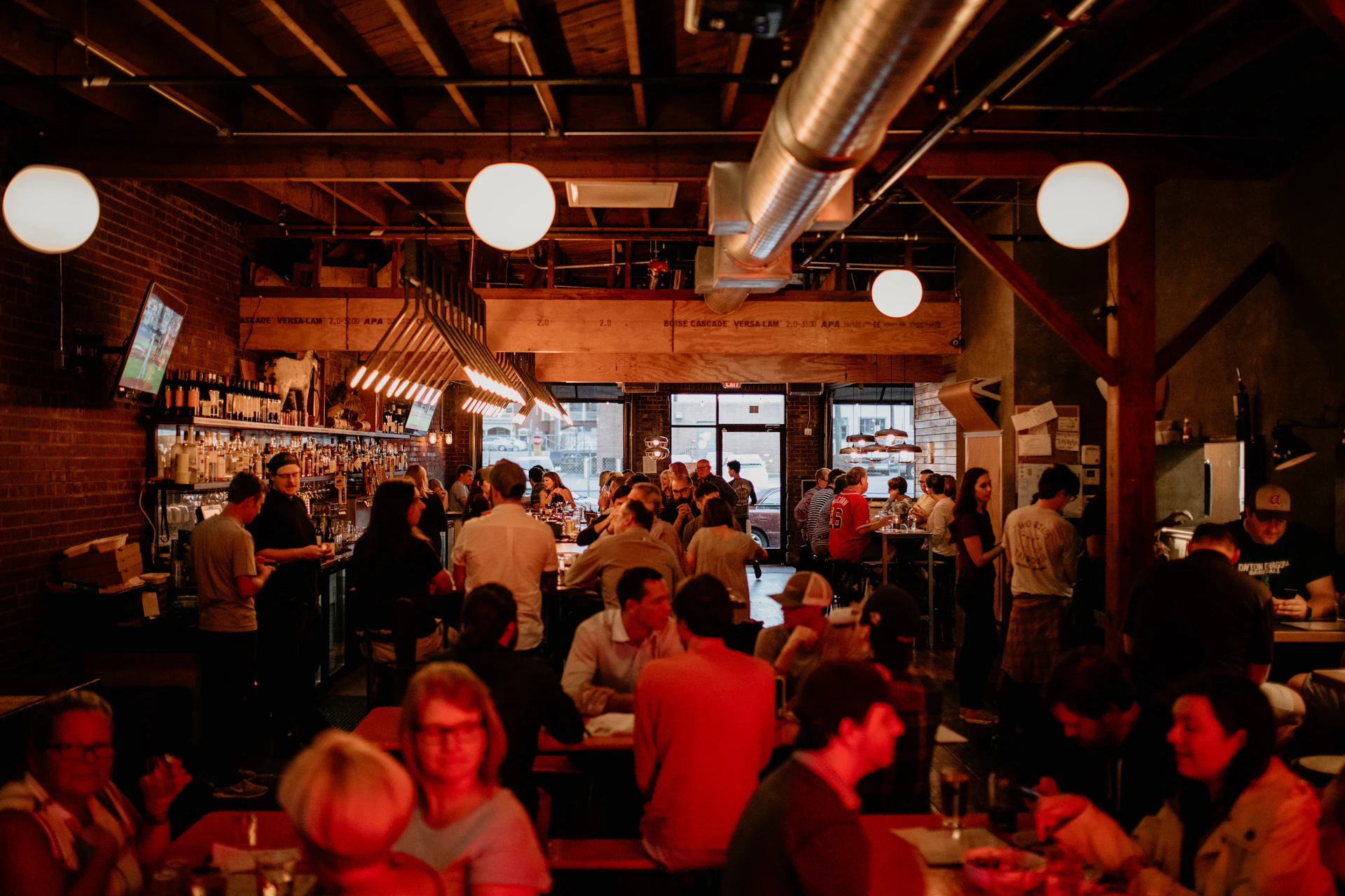A busy restaurant dining room during evening service