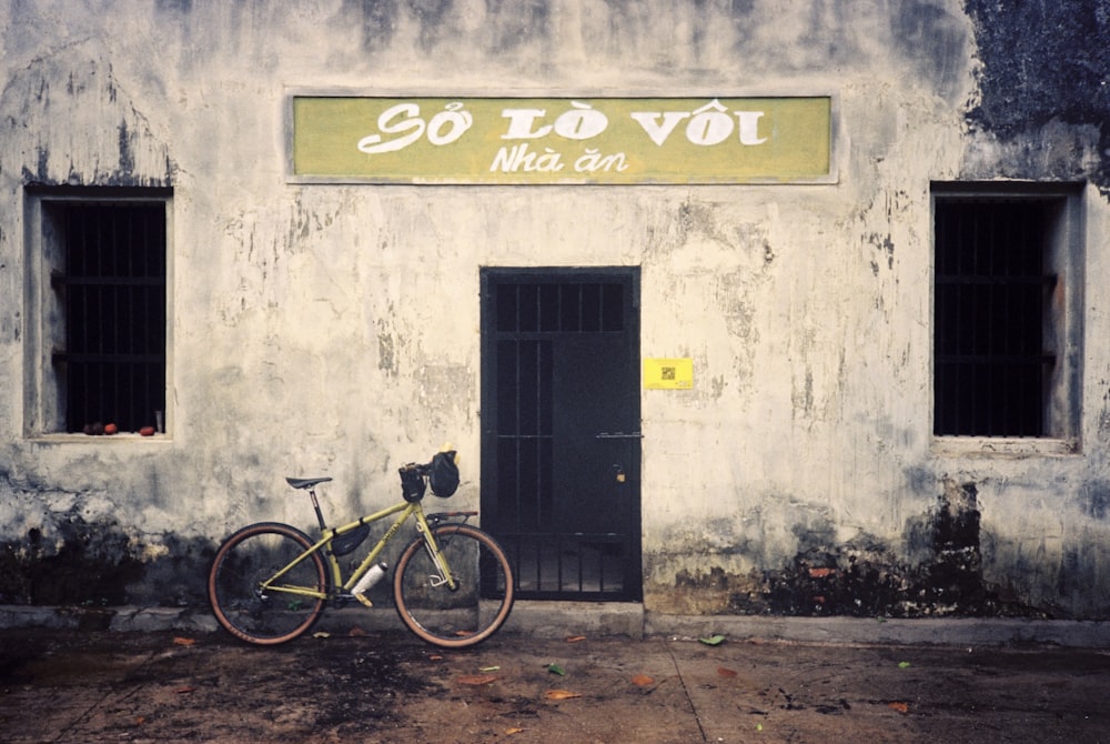 a bike parked in front of a building