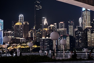 A dynamic business community networking event showing entrepreneurs exchanging ideas with modern city skyline background.
