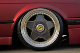 Four 3D renders of the 9rs wheel in matt gold, matt titanium, matt black, and gloss black finishes displayed side by side.