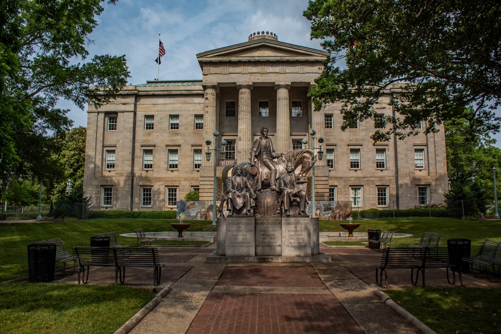 a large building with a statue in front of it