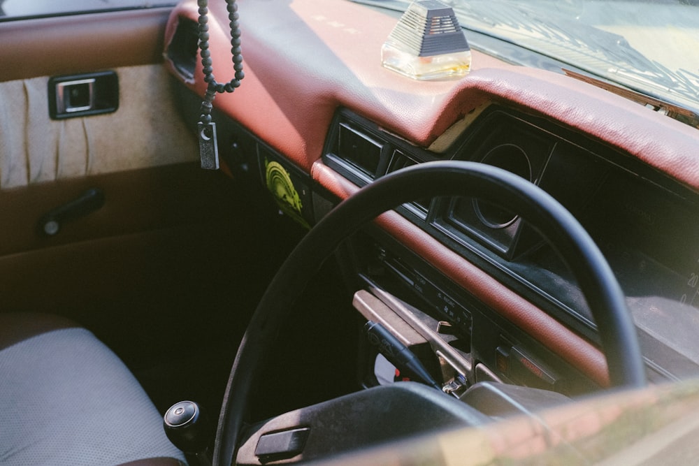 the interior of a car with a lamp on the dashboard