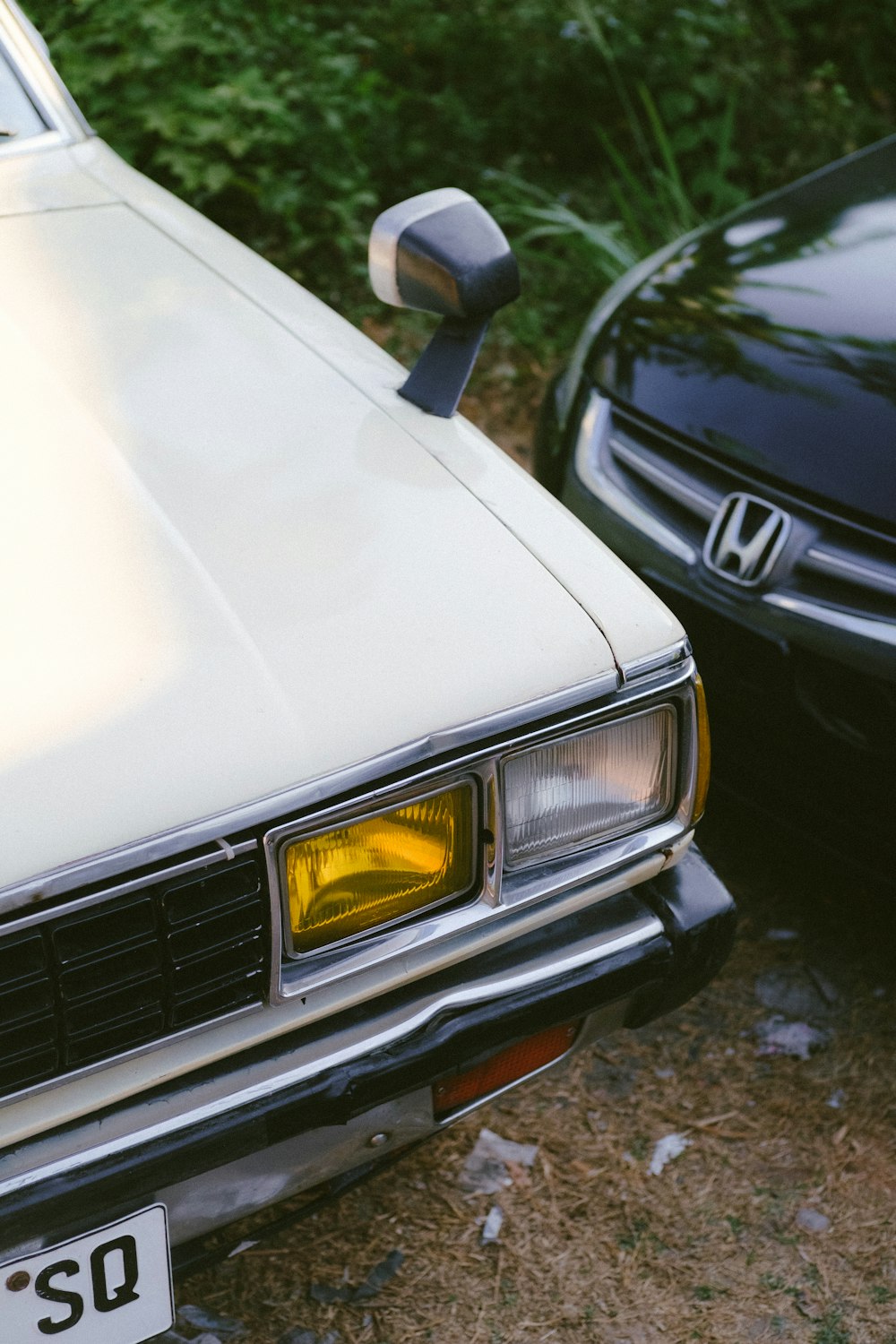 a couple of cars parked next to each other