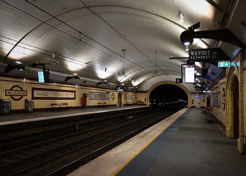 a train station with a train on the tracks