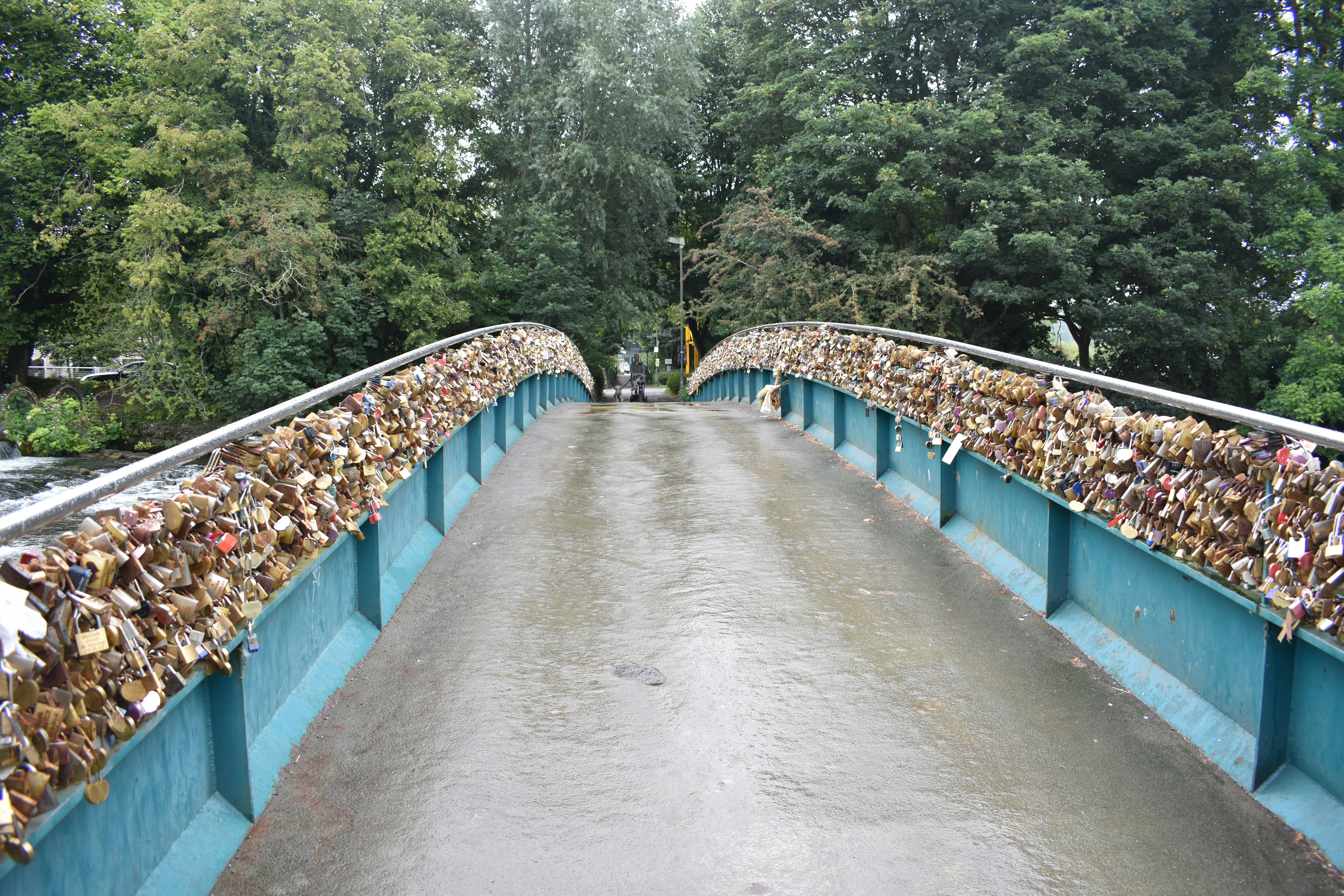 a bridge that has a bunch of padlocks on it